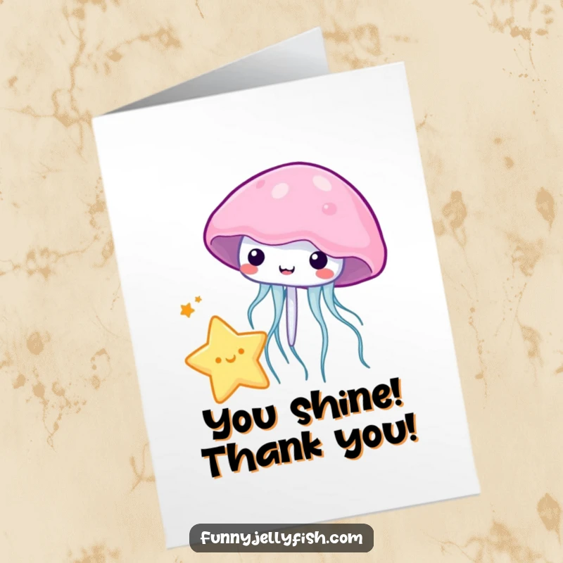 Funny free printable thank you card where a kawaii jellyfish playfully bounces a tiny star with its bell, a unique way to say thanks.